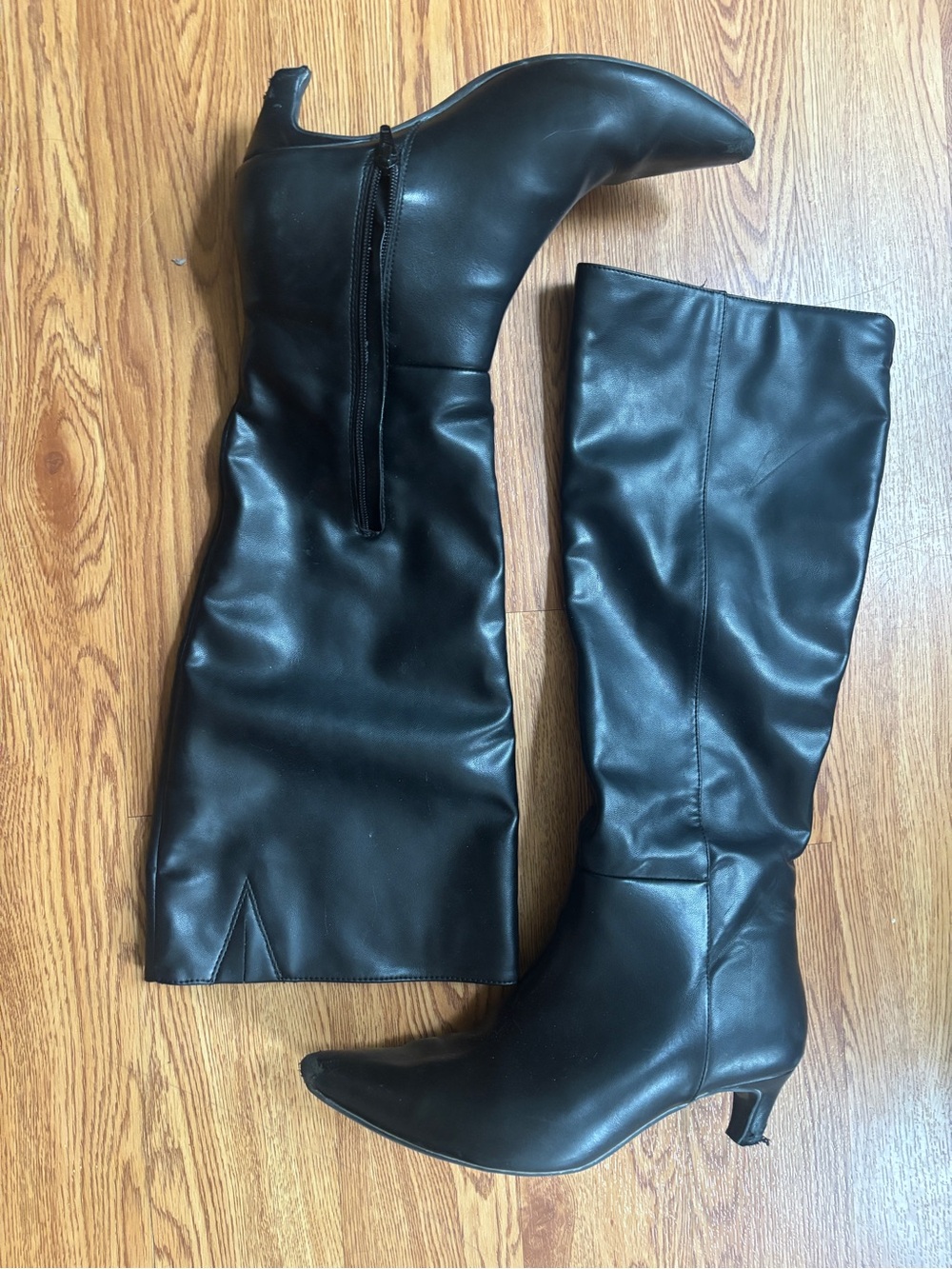 Well worn knee high Leather Boots